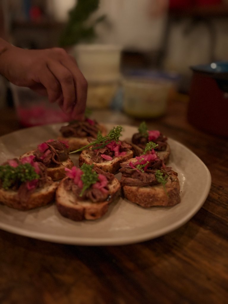 Crostini being plated